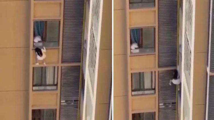 yuksek-katli-binada-tehlikeli-anlar-evli-asik-cunku-dusmemek-icin-camlardan-destek-aldi-XD1XblZF.jpg